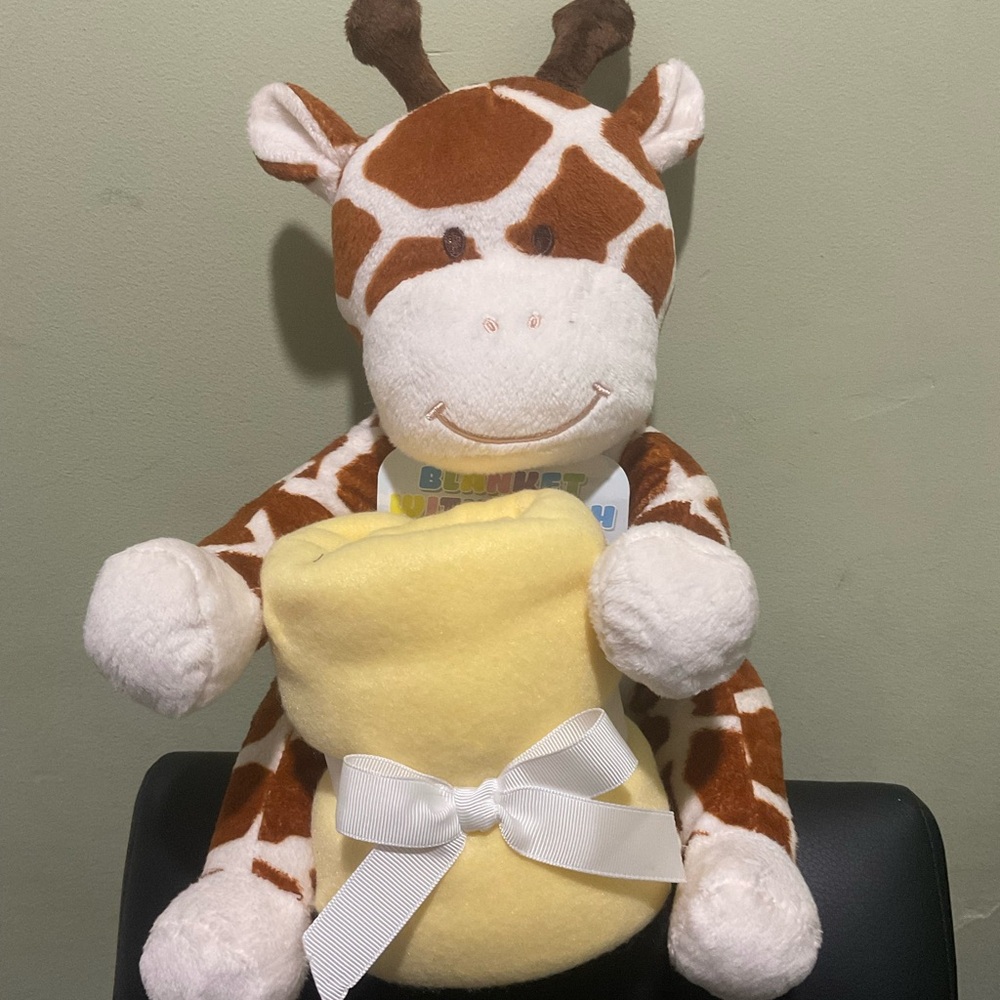 Giraffe plushie with blanket